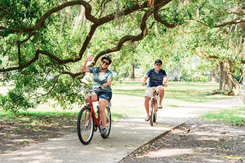 A couple rides under the Oak trees in New Orleans, Louisiana