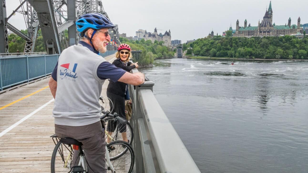 A couple enjoys the view over the river in Ottawa, Canada