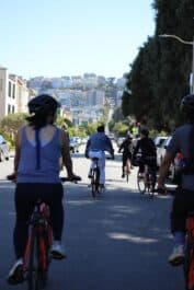 Bikes ride downhill in San Francisco, California