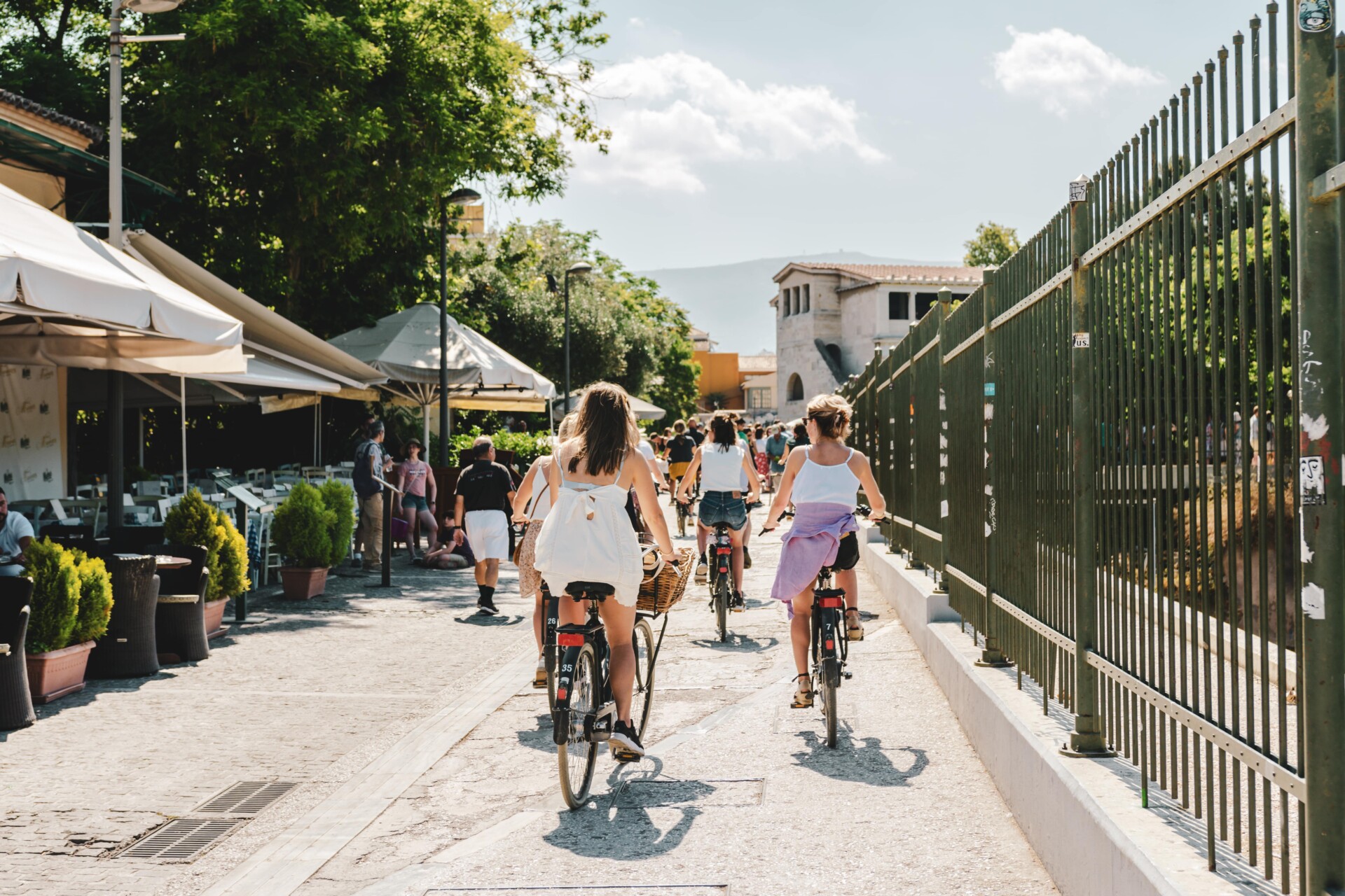 a group of cyclists riding through Athens, Greece