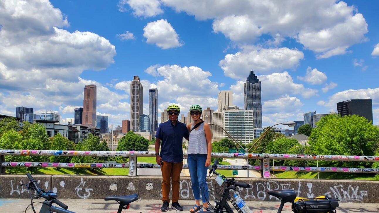 A couple poses for a photo on the Jackson Street Bridge in Atlanta, Georgia
