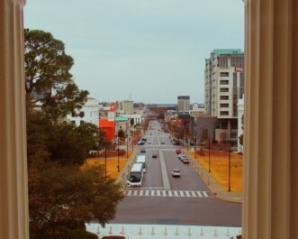 A view of a street in Atlanta, Georgia from between two columns