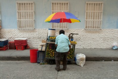 A man prepares to sell fruit and juice in Bogota, Colombia