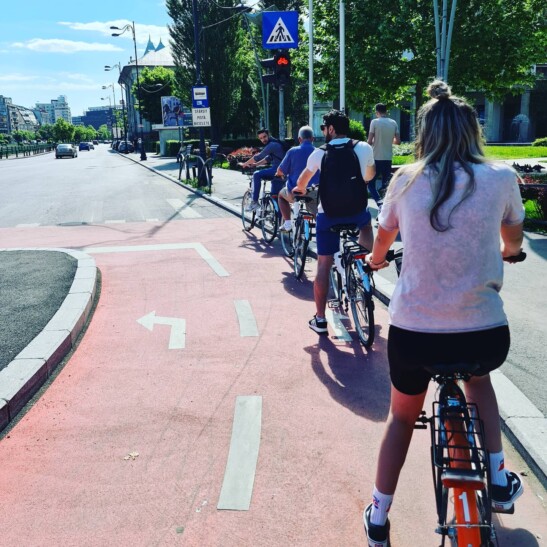 Cyclists ride along a bike path in Bucharest, Romania