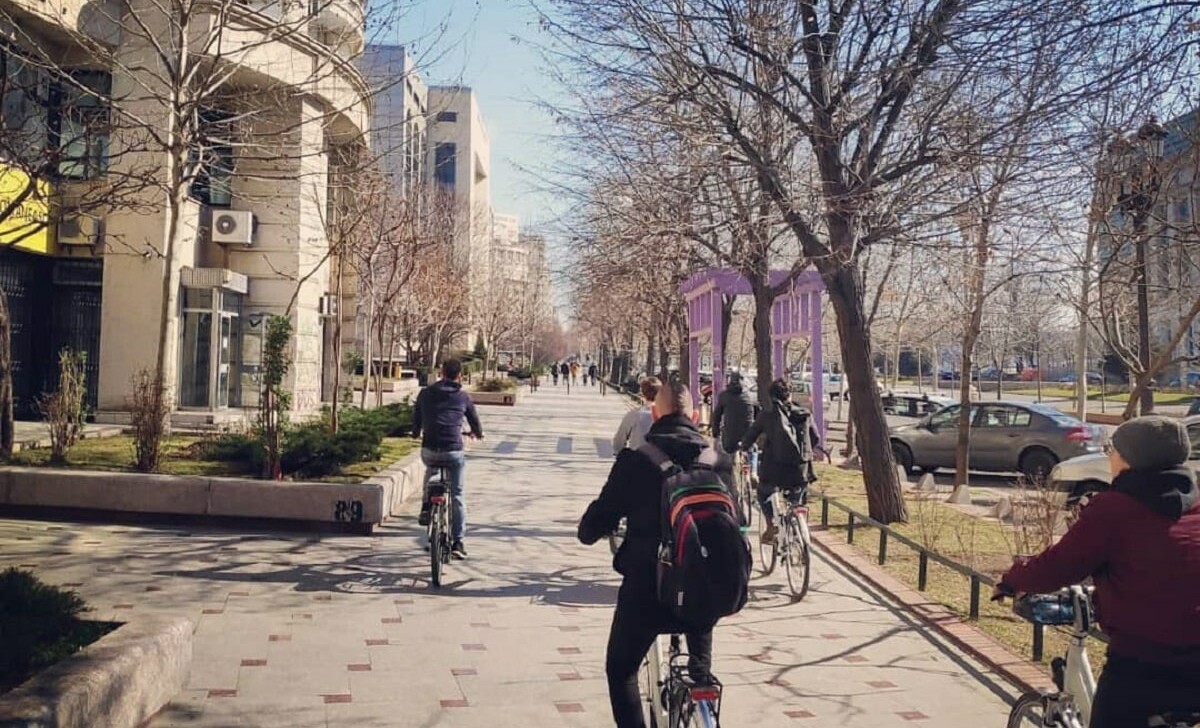 Cyclists ride along Union Boulevard in Bucharest, Romania