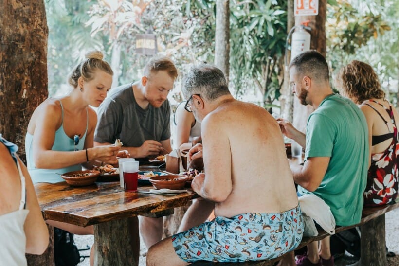 A group sits down to lunch in the jungle in Tulum, Mexico