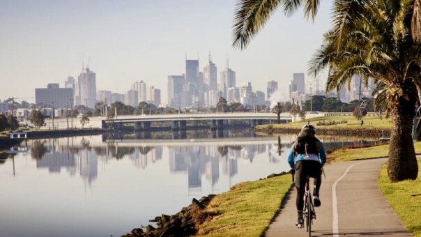 A cyclist riding along the river in Melbourne, Australia
