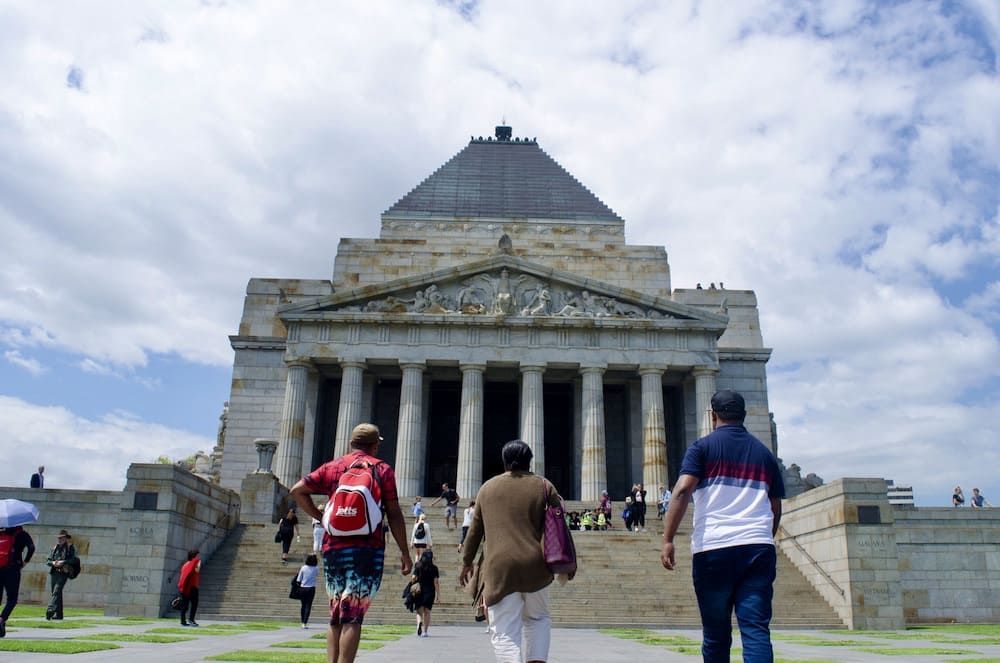People walking towards the Shrine of Remembrance in Melbourne, Australia