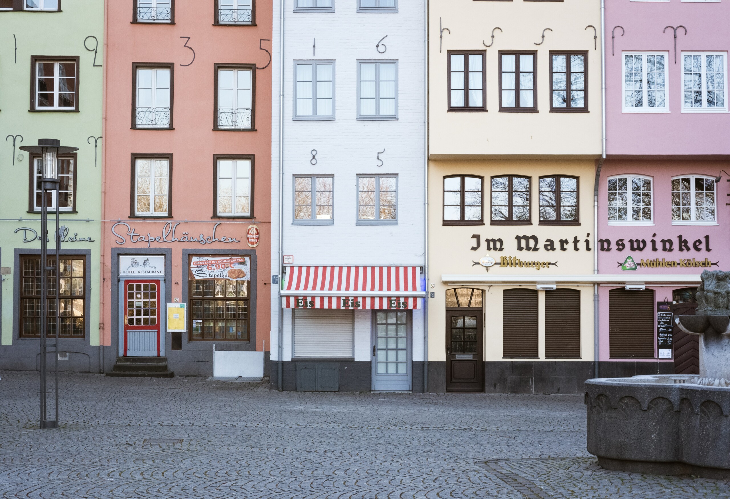 A row of colorful homes and shops in Cologne, Germany