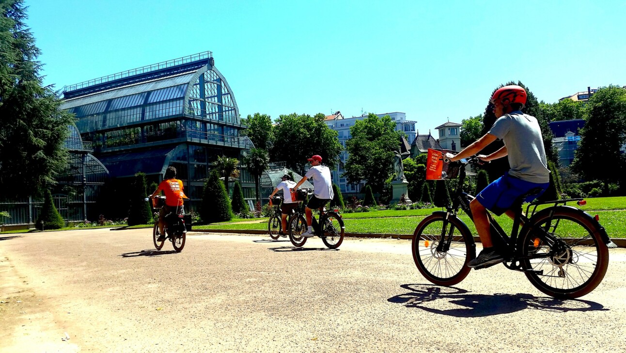 Cyclists ride through the Serres botanical garden in Lyon, France
