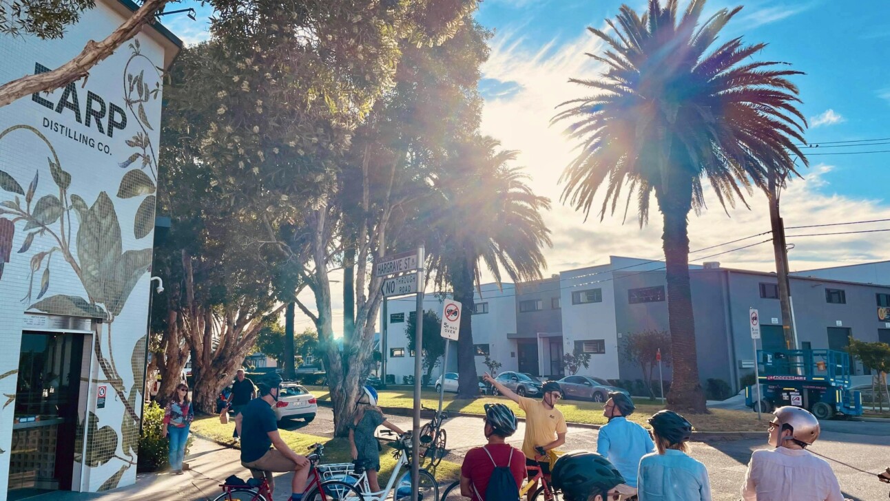 A group of cyclists on a sunny day in Newcastle, Australia