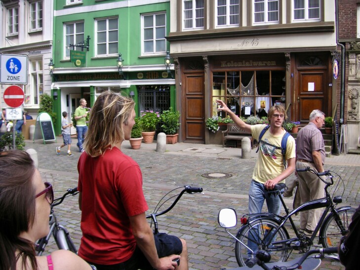 A guide during a bike tour in Hamburg, Germany