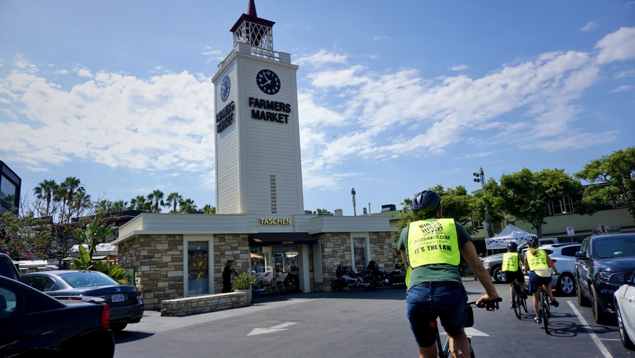 Cyclists ride to the Farmer's Market in Los Angeles, California