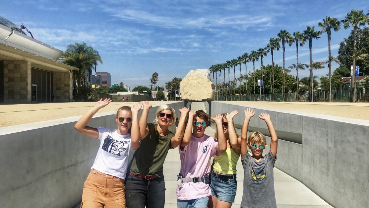 A family poses by the Los Angeles County Museum of Art in California