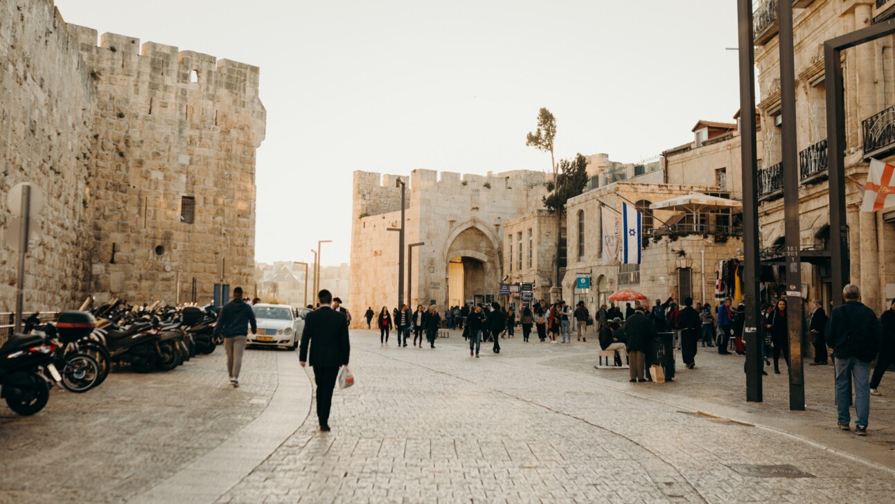 A man walking towards Jaffa Gate in Jerusalem