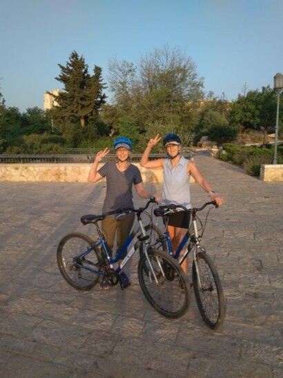 Cyclists posing for a photo as the sun rises in Jerusalem
