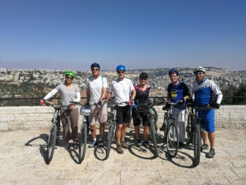 Cyclists pose for a photo in Jerusalem