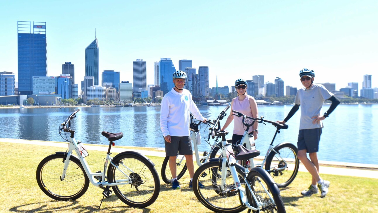 A group of cyclists pause for a break in South Perth, Australia