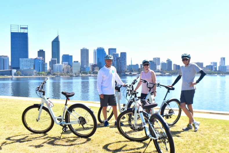 A group of cyclists pause for a break in South Perth, Australia