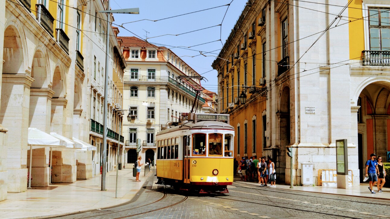 A yellow tram car in Baixa, Lisbon, Portugal