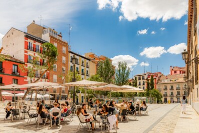 People sitting at outdoor cafes in Madrid, Spain