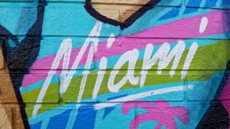 Miami spray-painted on a brick wall
