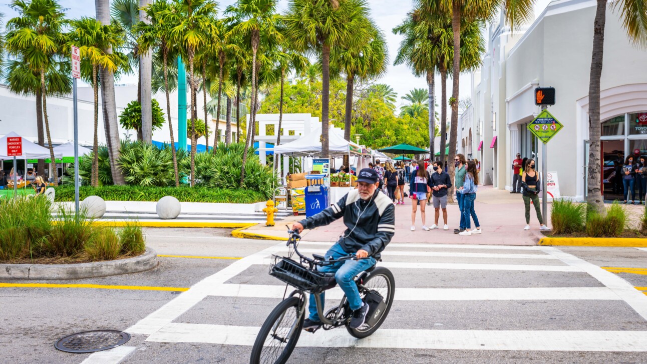 A man riding an e-bike in Miami, Florida