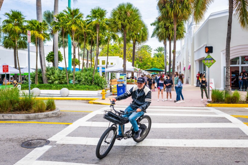A man riding an e-bike in Miami, Florida