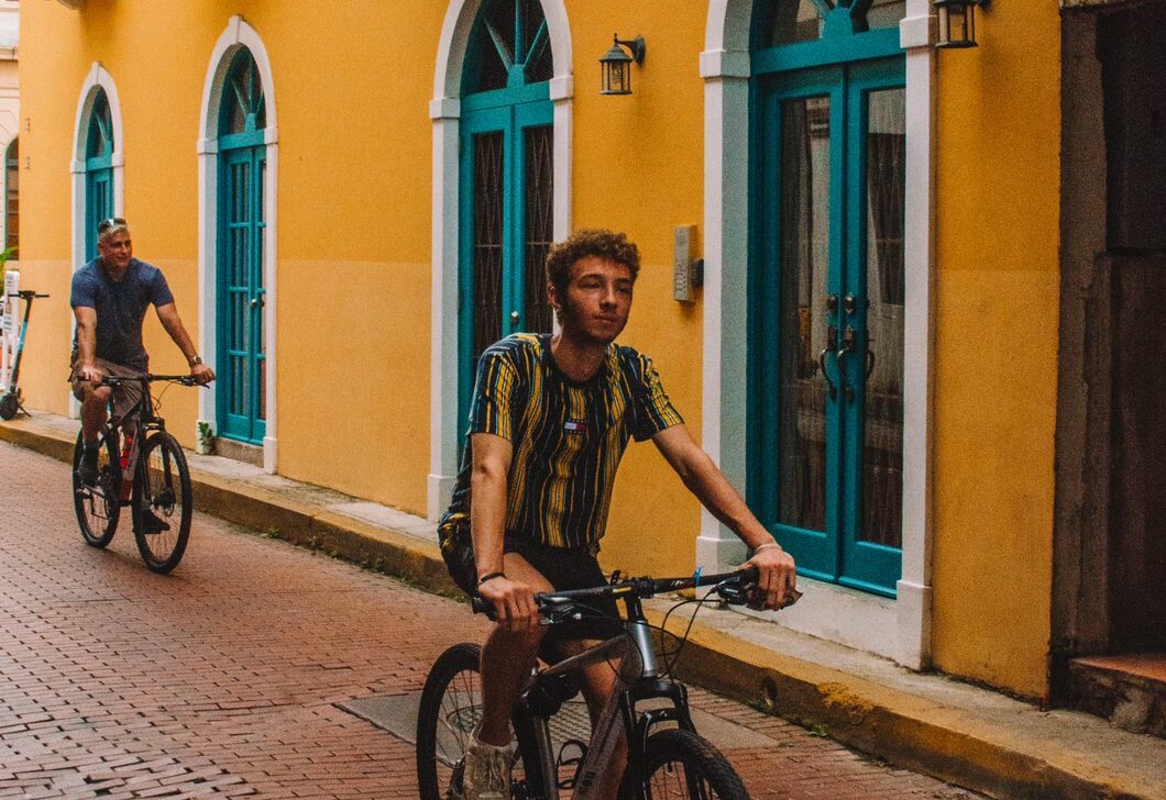Cyclists ride through the Spanish Old Town in Panama City