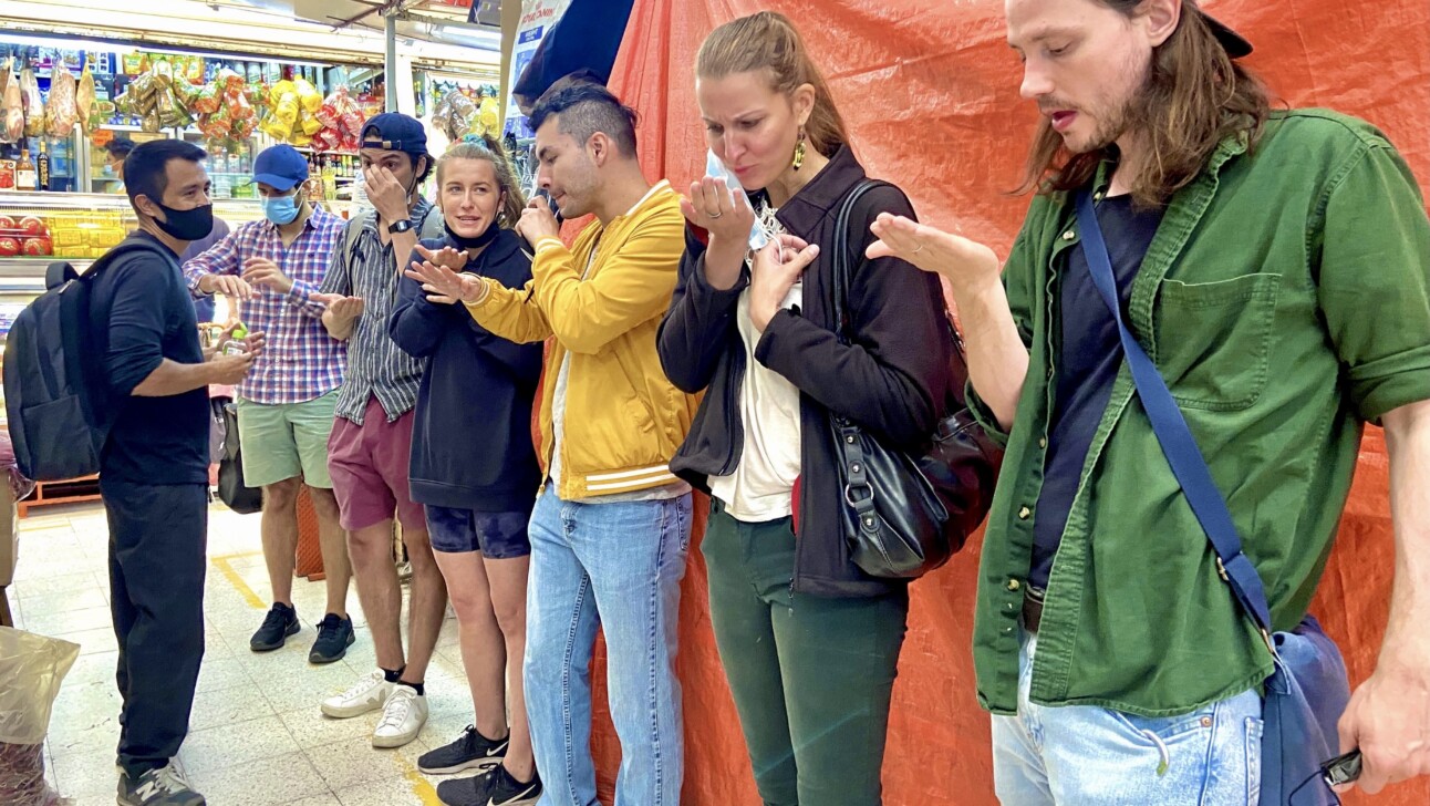 A group visits a local market in Mexico City