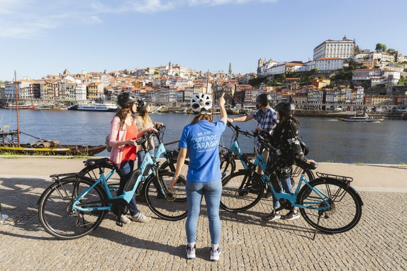 A guide explains the sites surrounding Ribeira Square in Porto, Portugal