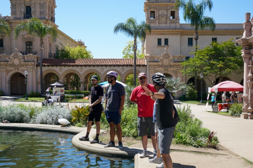 A guide explains the history of the Mission in San Diego